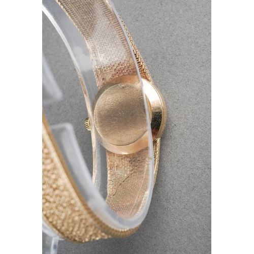 1047 - A 9ct gold Vintage 1970s Omega wristwatch. The silver tone dial, with black enamel gilt hourly appli... 