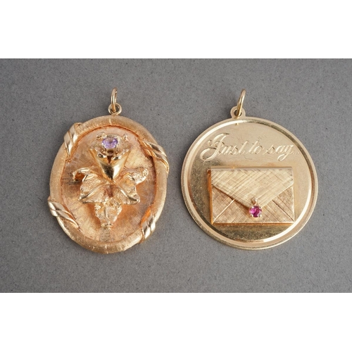 1067 - Two American Dankner charms. To include a floral charm (stamped 14k, sponsors mark rubbed), together... 