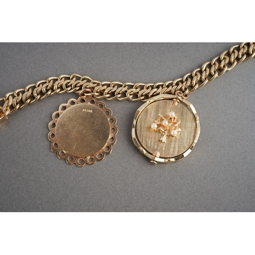 1070 - An American charm bracelet with charms attributed to Dankner. The solid fancy curb link chain suspen... 