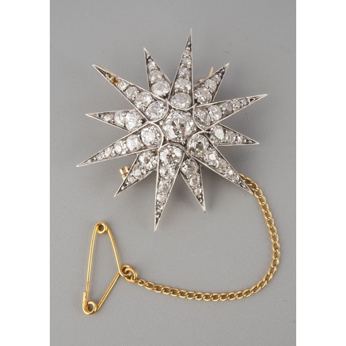 A late 19th century diamond star brooch. The twelve ray star set throughout with old cut diamonds and rose cut diamond accents, estimated principal diamond weight 0.64cts, estimated total overall diamond weight 3.50cts, assessed colour F-G-H, assessed clarity VS-I1, approx diameter 38mm, AF (one rose cut diamond missing), approx gross weight 7.61 grams.
