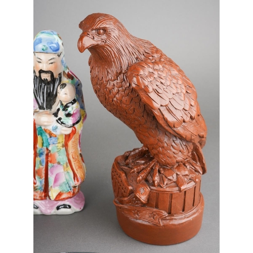 101 - A mixed collectors lot to include a resin model of an American eagle, carved wod bear, Canadial Levi... 