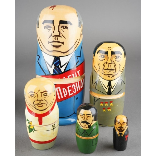 102 - Collection of various Russian related items to include two russian dolls, hat, unopened cigarete pac... 