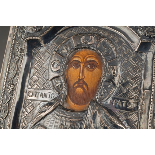 197 - A 20th century Russian icon of rectangular form, the embossed white metal front stamped 900 to top a... 