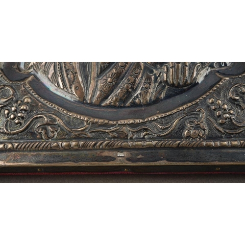 197 - A 20th century Russian icon of rectangular form, the embossed white metal front stamped 900 to top a... 