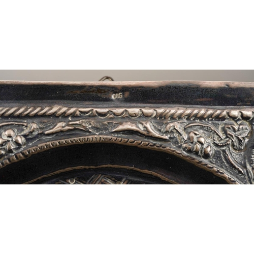 197 - A 20th century Russian icon of rectangular form, the embossed white metal front stamped 900 to top a... 