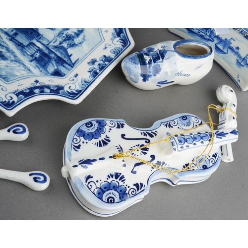 305 - A large collection of Delph ware to include a large violin, cow on base, plates, money bank, trinket... 