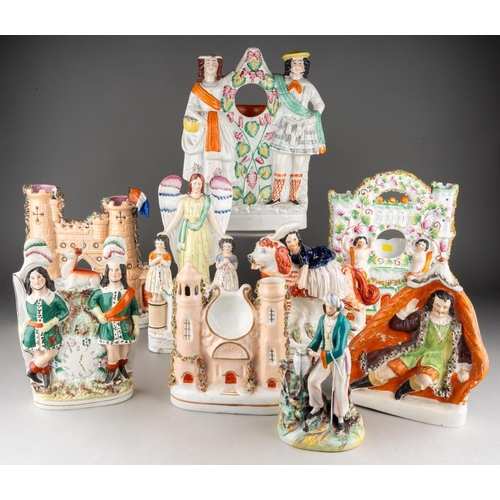 357 - A collection of nine Victorian Staffordshire pottery figures, comprising a figure of a Turk with pit... 