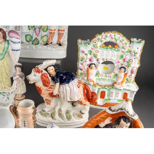 357 - A collection of nine Victorian Staffordshire pottery figures, comprising a figure of a Turk with pit... 