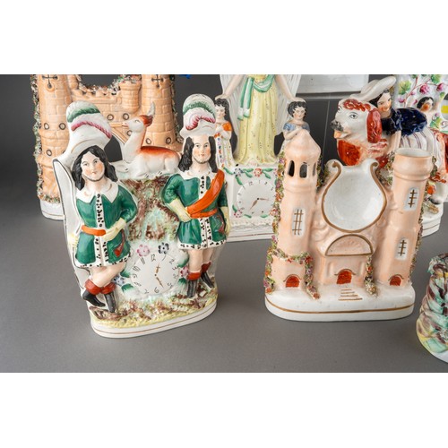 357 - A collection of nine Victorian Staffordshire pottery figures, comprising a figure of a Turk with pit... 