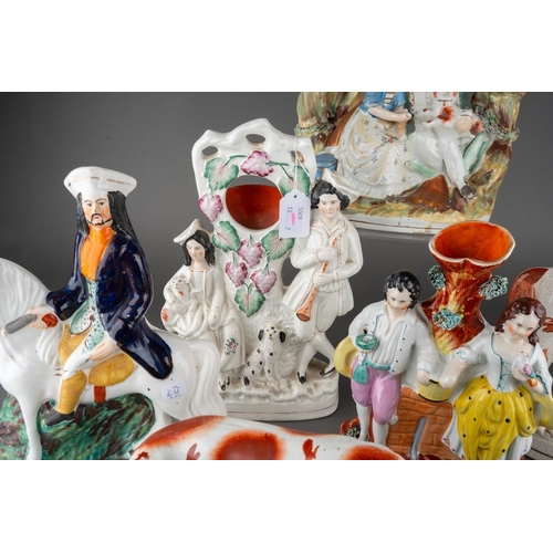 358 - A collection of seven Victorian Staffordshire pottery figures, comprising a cow by a stream (restore... 