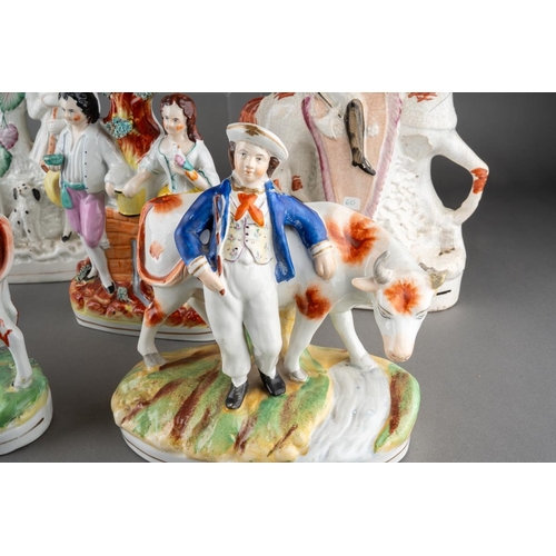 358 - A collection of seven Victorian Staffordshire pottery figures, comprising a cow by a stream (restore... 