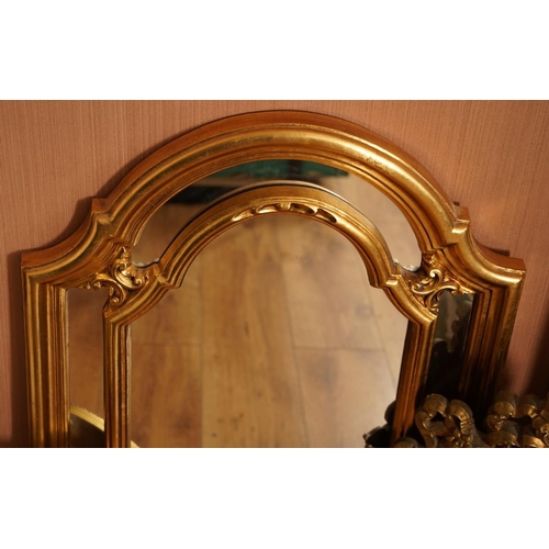 564 - Three modern gilt framed wall mirrors, the largest of arched form with inner gilt divisions, overall... 