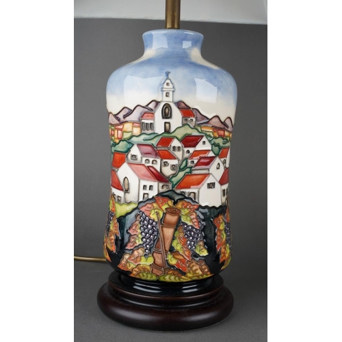 566 - A  pair of tube line decorated table lamps with shades in the style of moorcroft, each approx. 32 cm... 