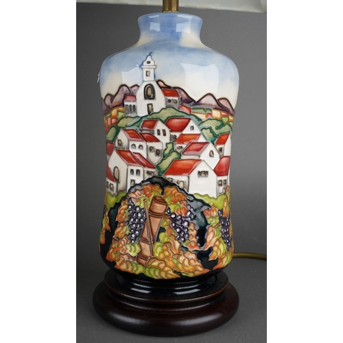 566 - A  pair of tube line decorated table lamps with shades in the style of moorcroft, each approx. 32 cm... 