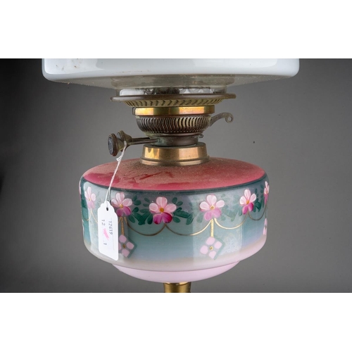 569 - An early 20th century brass based oil lamp, the white glass domed shade with frilled top, comes with... 