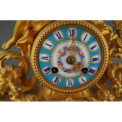 575 - A late 19th Century gilt metal figural mantel clock, with porcelain dial, Roman numerals,  Japy Frer... 