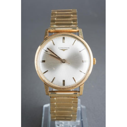 577 - A Longines mens 9ct gold watch with paperwork and in original box