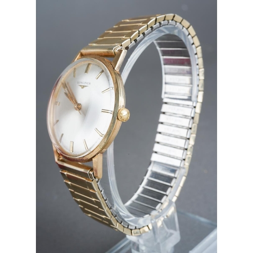 577 - A Longines mens 9ct gold watch with paperwork and in original box