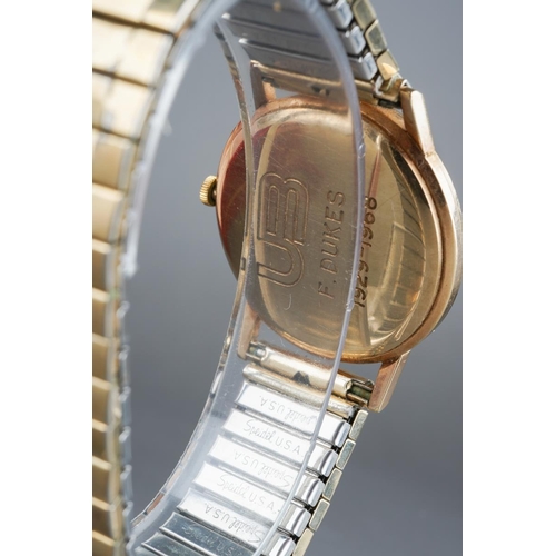 577 - A Longines mens 9ct gold watch with paperwork and in original box