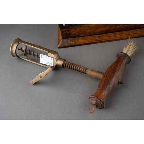 651 - A late 19th century Walker and Hall EPNS mounted oak tantalus, fitted with three square decanters, o... 