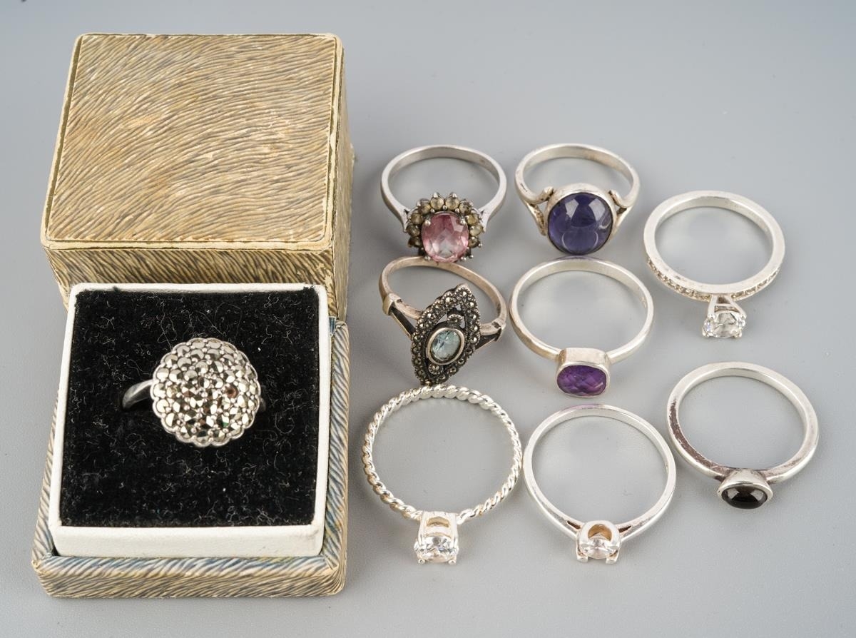 A collection of silver and white metal rings. Stamped 925, or unmakred ...