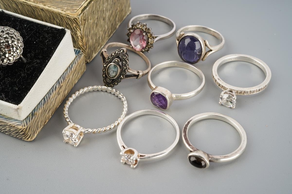 A collection of silver and white metal rings. Stamped 925, or unmakred ...