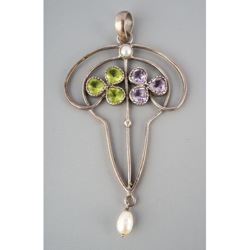 774 - A peridot and amethyst pendant. With fresh water cultured pearl accents, reminiscent of the Suffrage... 