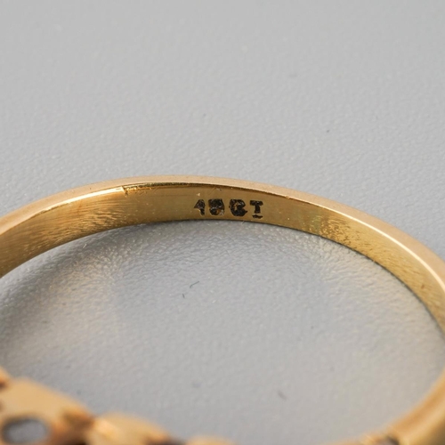 782 - A mid 20th century diamond ring. Stamped 18ct, approx ring size J, approx gross weight 2.6 grams.