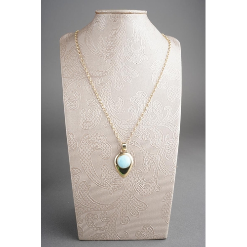 783 - A glass pendant and chain. Set with a glass cabochon, to the plain polished pendant with chain, pend... 