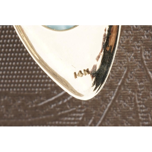 783 - A glass pendant and chain. Set with a glass cabochon, to the plain polished pendant with chain, pend... 