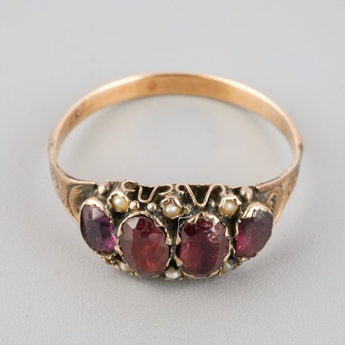 784 - A Victorian 9ct gold garnet and seed pearl dress ring. Stamped 9ct, approx ring size P, approx gross... 