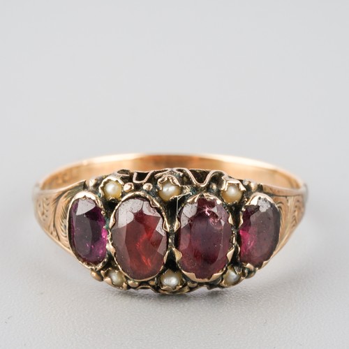 784 - A Victorian 9ct gold garnet and seed pearl dress ring. Stamped 9ct, approx ring size P, approx gross... 