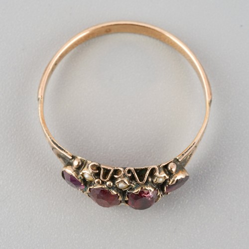 784 - A Victorian 9ct gold garnet and seed pearl dress ring. Stamped 9ct, approx ring size P, approx gross... 