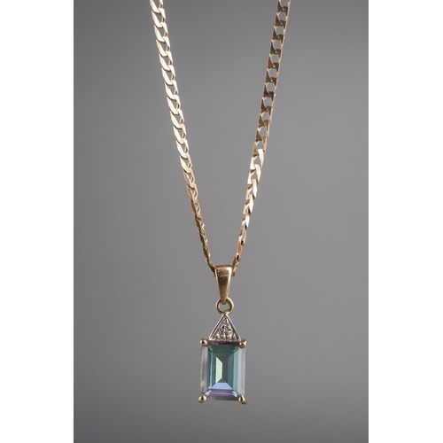 785 - A 9ct gold topaz and diamond pendant with chain. The coated topaz with diamond accent detail, hallma... 