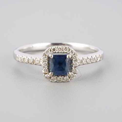 792 - An 18ct gold sapphire and diamond cluster ring. Hallmarked 18ct gold, sponsors mark Beaverbrooks, wi... 