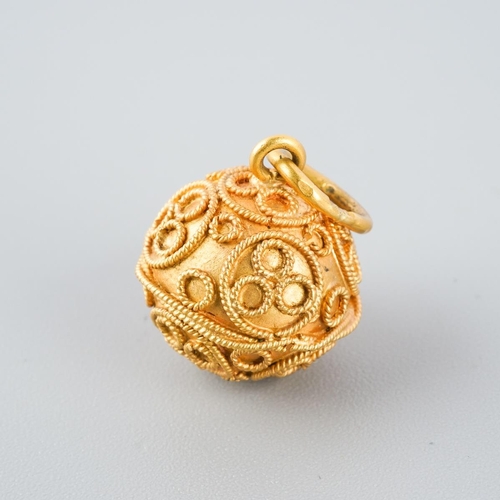 800 - A charm. With cannetille detail, stamped k22, approx diameter approx gross weight 3.9 grams.