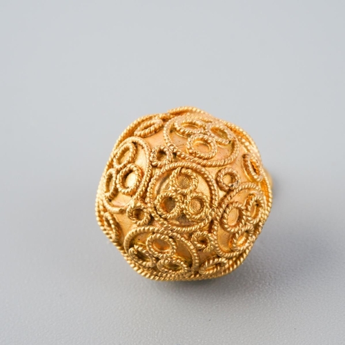 800 - A charm. With cannetille detail, stamped k22, approx diameter approx gross weight 3.9 grams.