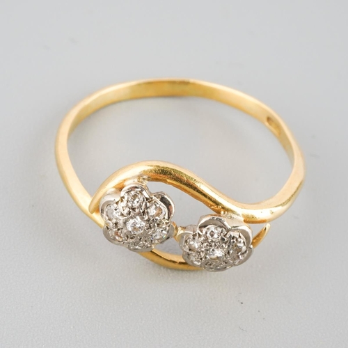873 - An 18ct gold diamond double cluster ring. Hallmarked 18ct gold, approx ring size L, approx gross wei... 