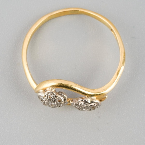 873 - An 18ct gold diamond double cluster ring. Hallmarked 18ct gold, approx ring size L, approx gross wei... 
