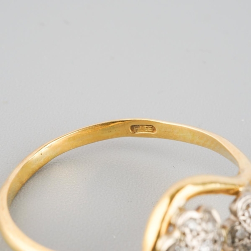 873 - An 18ct gold diamond double cluster ring. Hallmarked 18ct gold, approx ring size L, approx gross wei... 