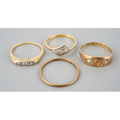 874 - A selection of four gold and diamond set gold rings. To include a 22ct gold wedding band (hallmakred... 