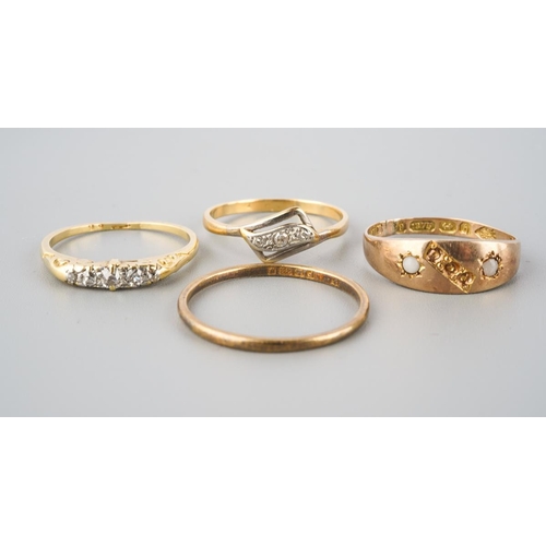 874 - A selection of four gold and diamond set gold rings. To include a 22ct gold wedding band (hallmakred... 