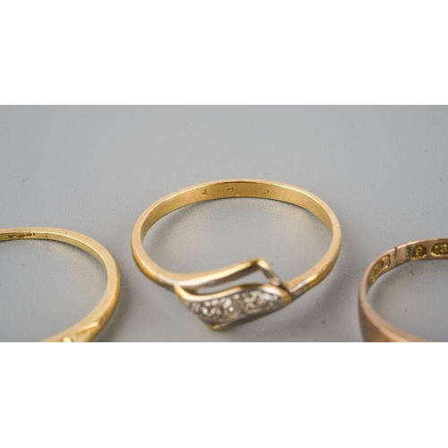 874 - A selection of four gold and diamond set gold rings. To include a 22ct gold wedding band (hallmakred... 