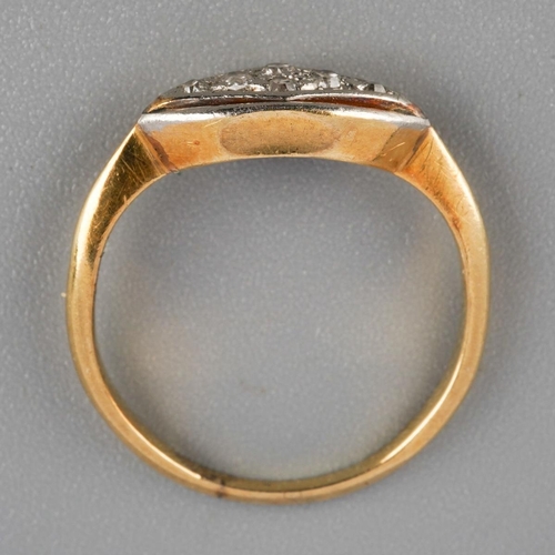 914 - An early 20th century diamond ring. Set with single cut diamonds, stamps worn away, assessed as appr... 
