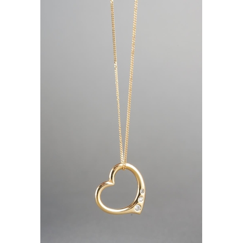 916 - A diamond pendant and chain. The heart shape pendant set with graduated round brilliant and single c... 