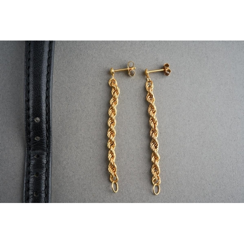 918 - A Longines quartz watch, together with three pairs of earrings, all unmarked, two pairs assessed as ... 