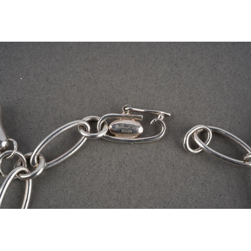 927 - A charm bracelet by Elsa Peretti for Tiffany & Co. The bracelet suspending five charms, bracelet sig... 