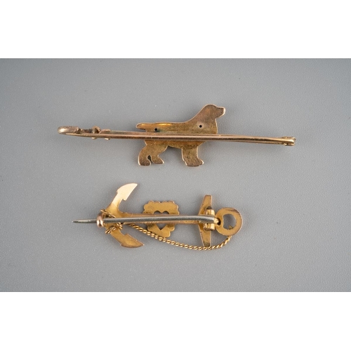 943 - Two 9ct gold brooches to include bar brooch with a spaniel dog marked 9 ct and an anchor sweetheart ... 