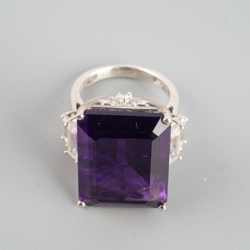 954 - An amethyst single stone ring. Stamped 925, approx ring size L, approx gross weight 9.69 grams.