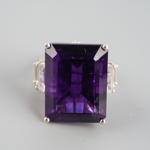 954 - An amethyst single stone ring. Stamped 925, approx ring size L, approx gross weight 9.69 grams.